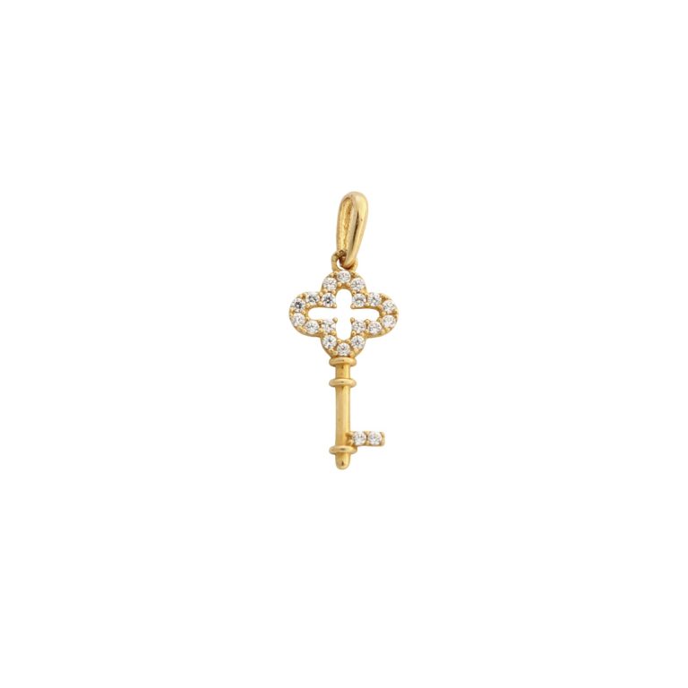 Medalha de ouro em forma de chave, símbolo de memórias e novos começos.